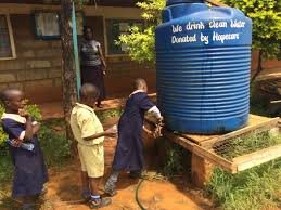 Residents and volunteers connecting during a clean water and sanitation activity.